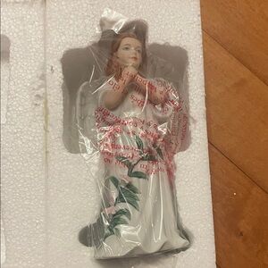 Porcelain Angel Figurine with Pink and Green Accents